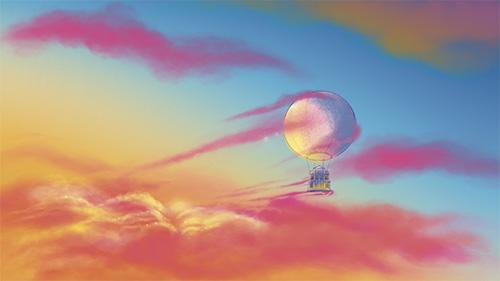 Ballon-montgolfière transportant l'Opéra de Rennes dans le ciel au coucher de soleil, avec des nuages
